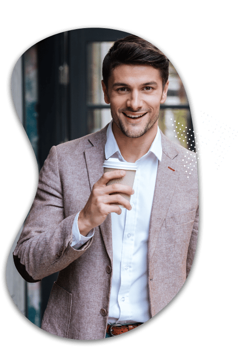 business man in pink tweed blazer drinks coffee considers workload automation job scheduling alternatives with rmt robert mark technologies